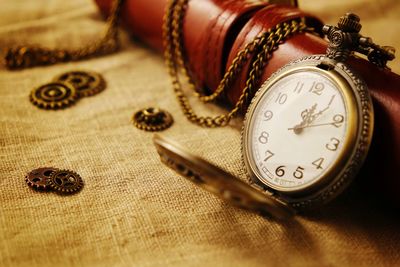 Close-up of clock on table