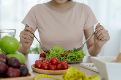 Midsection of man preparing food