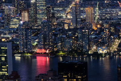 Illuminated buildings in city at night