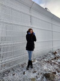Full length of man standing in snow