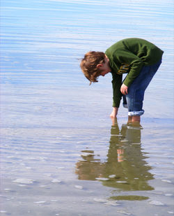 Reflection of woman in water