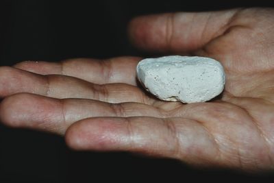 Close-up of hand holding stick