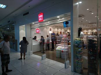 People standing in illuminated store