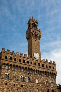 Clock tower of the palazzo vecchio built at the piazza della signoria in florence