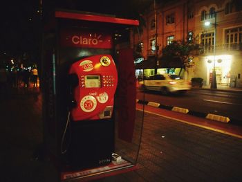 Information sign in city at night