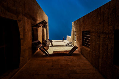 Directly below shot of staircase against building