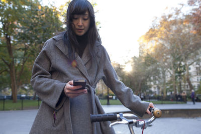 Portrait of a young woman in an urban park