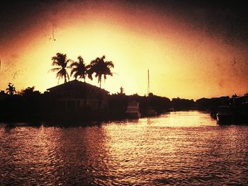 Scenic view of river at sunset