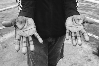 Close-up of man holding hands