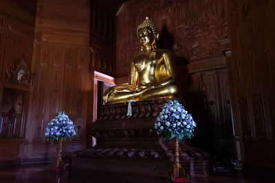 Low angle view of statue against building