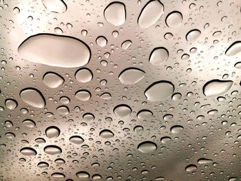 Close-up of water drops on glass