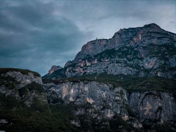 Low angle view of rock formation against sky