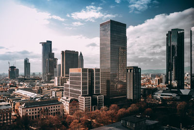 Modern buildings in city against sky