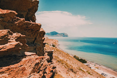 Scenic view of sea against cloudy sky