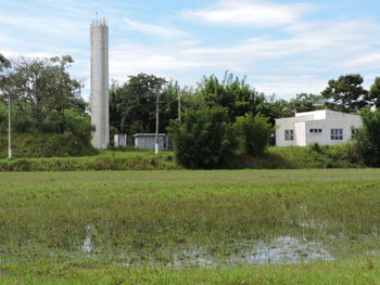 House on field against sky