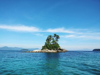 Scenic view of sea against blue sky