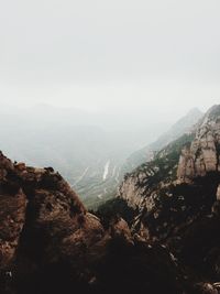 Aerial view of mountain range in foggy weather