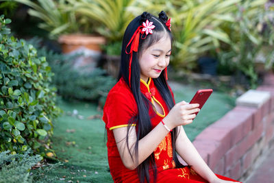 Young woman using mobile phone