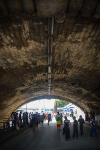 Group of people walking in corridor