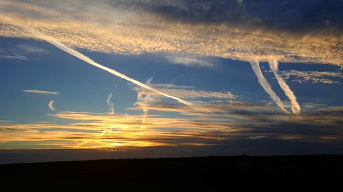 Scenic view of vapor trails in sky