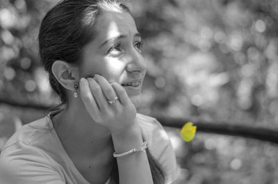 Woman looking away in sunny day