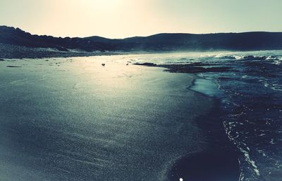 Scenic view of sea against sky at sunset