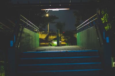 Illuminated staircase at night