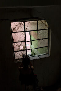 Woman standing in window