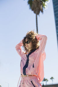 Woman standing against clear sky