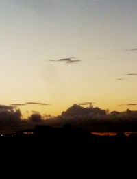 Scenic view of mountains against sky at sunset