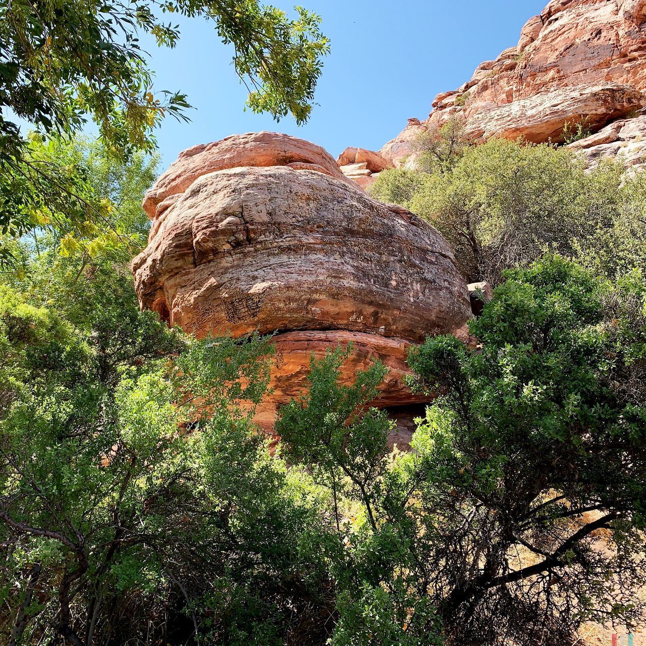 LOW ANGLE VIEW OF ROCK FORMATION AGAINST SKY