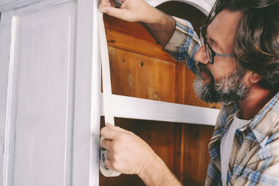 Close-up of man working at home