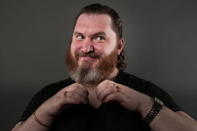 Portrait of man against black background