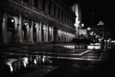 Illuminated fountain at night