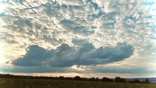 Scenic view of dramatic sky over land