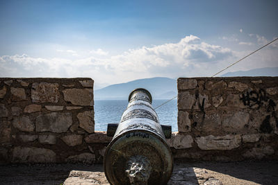 Low angle view of cannon facing the horizon