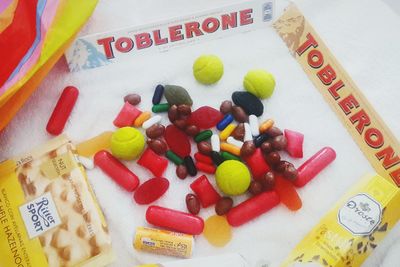 High angle view of multi colored candies on table