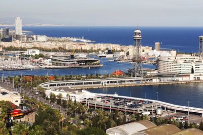 High angle view of harbor by buildings in city