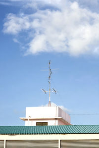 White clouds with the blue sky over the tv antenna