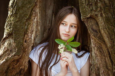 Young woman on a tree background