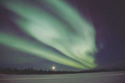 Scenic view of dramatic sky during winter at night