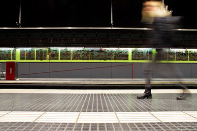 Blurred motion of train at railroad station