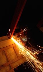 View of illuminated factory at night