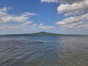Scenic view of sea against cloudy sky