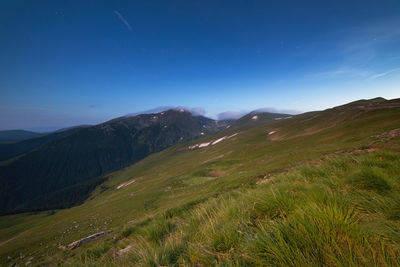 Scenic view of landscape against sky at night