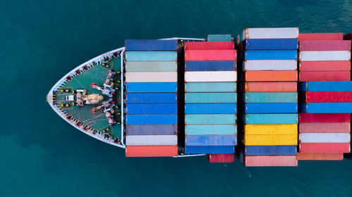 Aerial view of container ship sailing in sea