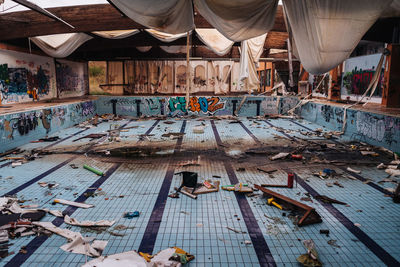 View of dirty abandoned swimming pool