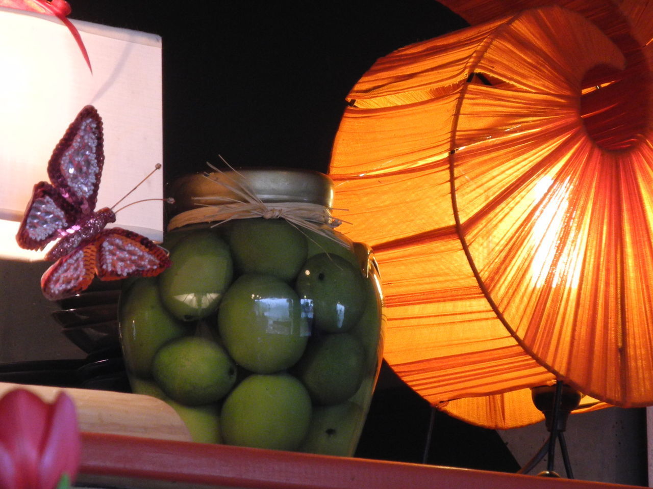 CLOSE-UP OF APPLES IN ILLUMINATED CONTAINER