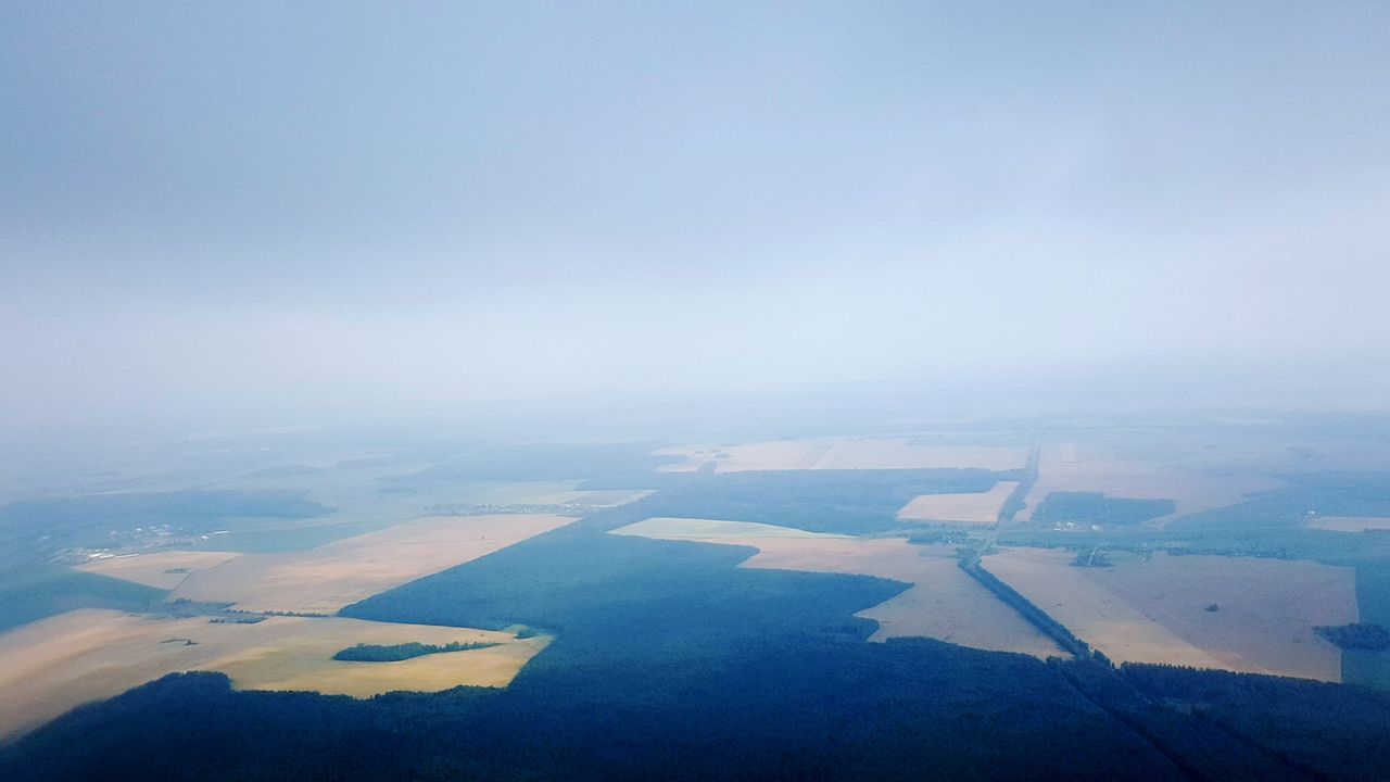 airplane, aerial view, transportation, aircraft wing, air vehicle, flying, mode of transport, architecture, sky, built structure, copy space, part of, water, cropped, nature, landscape, clear sky, day, travel, scenics