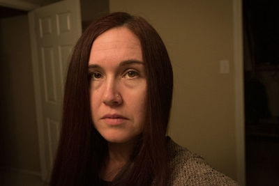 Close up of serious woman's face staring at camera